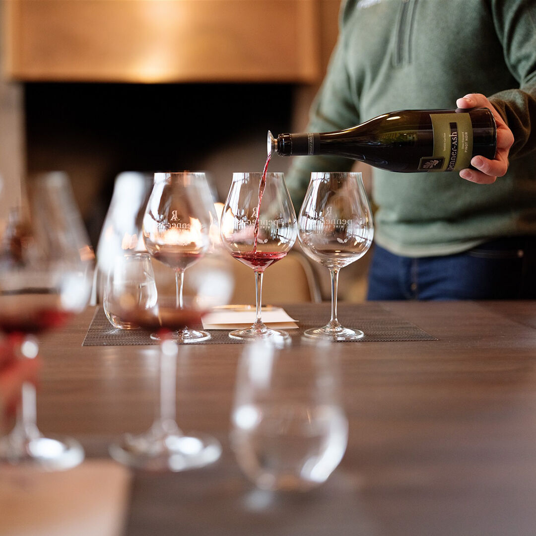 Pouring Shea Pinot Noir in Penner-Ash Tasting Room